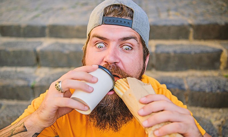 snacking man who will need dental care